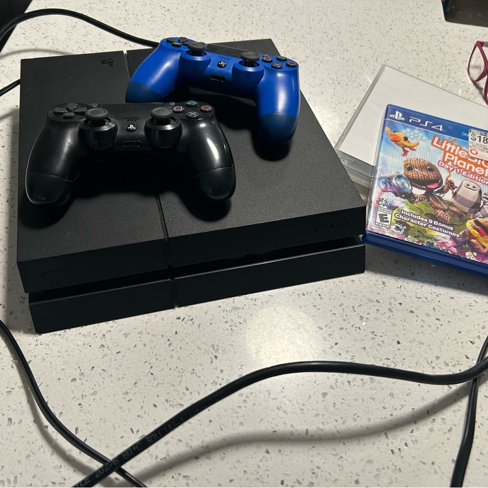 Sony PS4 Console with Black and Blue Controllers